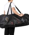 Person carrying XL Mesh Dive Bag For Scuba And Snorkel Gear, Heavy Duty Travel Duffle With Waterproof Pocket, fits mask and fins