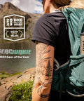 Person outdoors carrying Lite Bathroom Kit For Camping And Backpacking Ultralight Backcountry Gear With Easy Poop Bury System