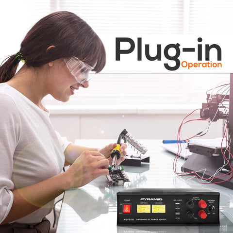 Woman using Universal Compact 50 Amp Adjustable Bench Power Supply, 12 To 15 Volts Output, with DIY electronics in home lab.