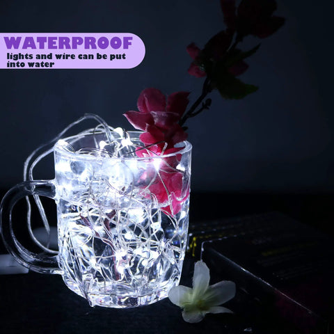 Battery Operated Fairy Lights Six Pack No Remote Waterproof Firefly String Lights On Silvery Copper Wire glowing in glass of water
