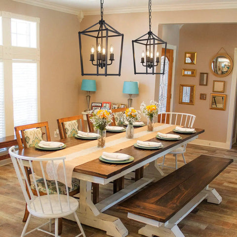 4 Light Black Farmhouse Chandelier With Open Iron Lantern Frame over dining table, showcasing industrial style ceiling fixture.