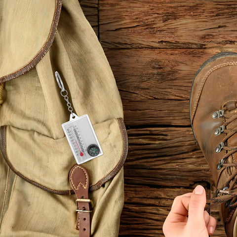 Two Pack Portable Keychain Compass With Thermometer Wear Resistant Mini Pocket Navigator clipped to backpack