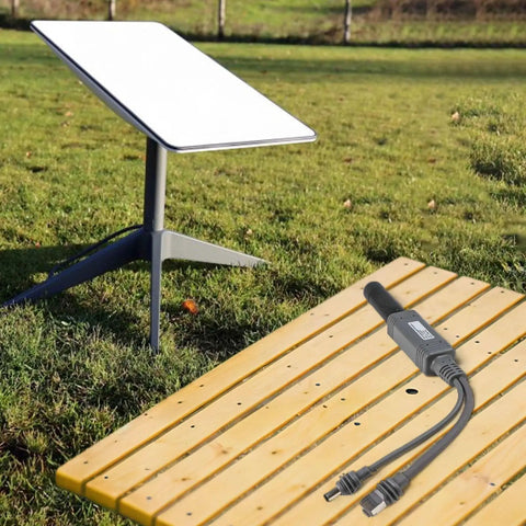 Power Over Ethernet Splitter For Mini Systems Keeps Your Setup Clean With One Cable Delivering Power And Data IP68 Rated 10 100 1000 Mbps Network Up To 100 Meters Ideal For Compact Home And Office Installations. Outdoor PoE splitter cable on bench with Starlink dish