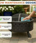 Hand cleaning 32 Inch Outdoor Wood Fire Pit With Screen, Poker, And Cover For Backyard Hangouts, Deck Or Patio, Durable Powder Coated Steel With Cross Weave Design In Black.