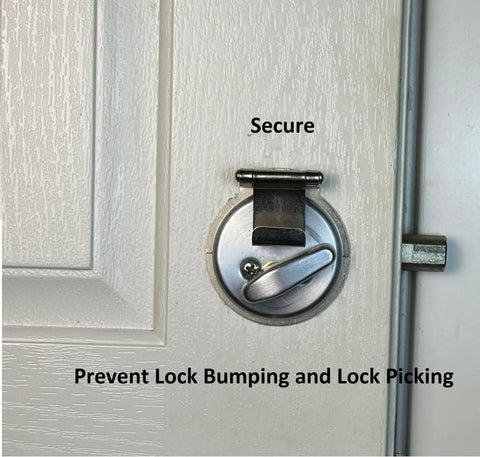 Front view of an Anti Bump And Anti Pick Deadbolt Guard For In Swing And Out Swing Doors Quick No Drill Install In Minutes Fits Most Single Cylinder Deadbolts Nickel Plated Adds Extra Home Security Without The Hassle on a white door.