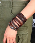 Dope Vintage Punk Wrap Bracelet Set Of Six Braided Faux Leather Cuffs For Men And Women adjustable brown stack worn on wrist.