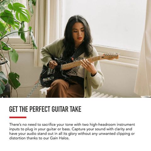 Musician playing electric guitar to record with Scarlett 8i6 Third Gen USB Audio Interface for recording, songwriting, and streaming.