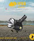 Beast 1 Million Lumens Spotlight With Solar Charging, 6 Modes, Rechargeable Handheld Flashlight on rocky surface, IPX6 waterproof