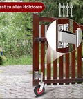 Spring Loaded Gate Caster Wheels Four Inch Rubber Tire Heavy Duty With Hardware installed on wooden swing gate