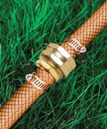 5/8 Inch Aluminum Garden Hose Repair Kit on hose with stainless steel clamps, visible on grass, leak-proof connection