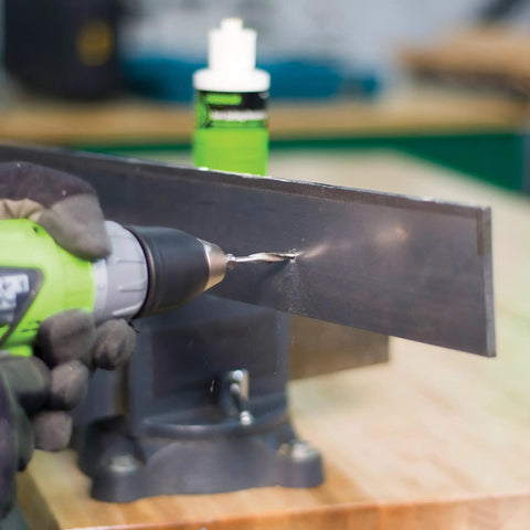 8-32 NC Do It All Combination Drill Tap Countersink Bit in use on a metal sheet with quick change hex shank