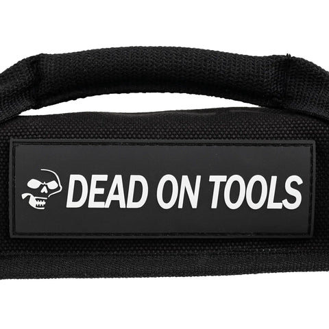 Padded handle of Heavy Duty 24 oz Canvas Large Wrench Roll Tool Bag with logo, signifying durability and USA-made quality.