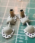 Beginner Stop Motion Metal Kit For Animators With Brass Square Tubes In Three Sizes One Eighth Inch Five Thirty Second Inch And Three Sixteenth Inch Twelve Inch Lengths Made In USA brass tube armature parts on cutting mat