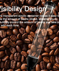 Keep It Fresh Wall Mount Coffee Bean Dispenser With Clear Acrylic Face And Aluminum Twist Lock Commercial Grade Dry Food Canister showing clear container filled with coffee beans.