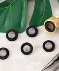 20 Pack Stainless Steel Hose Filter Washers With Screen Inlet Strainer displayed with a garden hose connector and leaves.