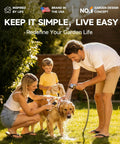 Family using a garden hose to wash a dog outdoors, showcasing lifestyle use of the Beefy Heavy Duty Metal Hose Holder with Freestanding Stand and Stable Triangular Base No Wobble Includes 2 Tool Hooks for Outdoor Yard and Lawn Storage Holds Up to 150 Feet of Hose.