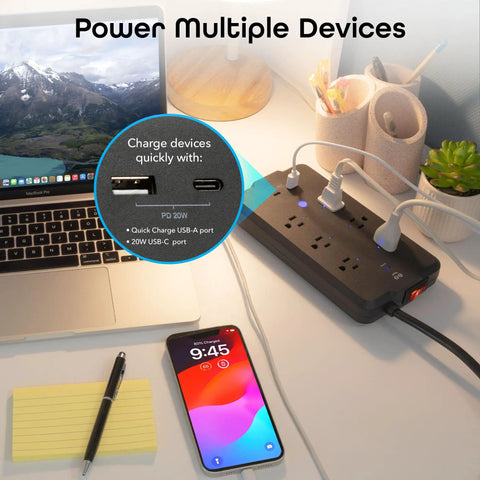 No Fuss Smart Power Strip With Individual Outlet Control, Rock Solid Surge Protection, Dual Fast Charging Usb A And C Ports, Straight Ahead Cable Management For Home Or Gaming Setup Black on desk with laptop and phone.