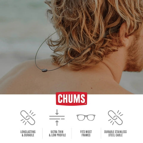 Lightweight Stainless Steel Cable Eyewear Retainer Keeps Your Shades Close All Day Easy Fit For Most Frames With Universal Attachments For Men And Women Black shown being worn by a person with long hair on the beach.