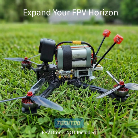 RHCP FPV Antenna Long Range Five Point Eight G installed on racing quadcopter on grass, antenna visible with label