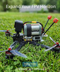 Beefy Long Range RHCP FPV Antenna For 5.8GHz Drones, 150mm IPEX UFL Connector on grass with racing quadcopter.