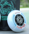 Close-up of blue inline skate replacement wheel with ABEC 9 bearing and 85A hardness on a skate-themed backdrop