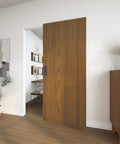Slick Concealed Sliding Barn Door With Hella Soft Close Hardware Kit And Invisible Rail System For Badass Smooth Gliding Action in a stylish room setting.