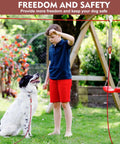 Boy with dog using Heavy Duty 200 Ft Dog Runner With 10 Ft Tie Out Cable For Big Dogs Up To 250 Lbs Safe Zip Line