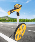 Hella Reliable Digital Measuring Wheel With Crisp Backlit Display For No Sweat Layouts And Smooth Rolling Distance Marking On Busy Construction Sites Or Steady Landscaping Jobs on a road.