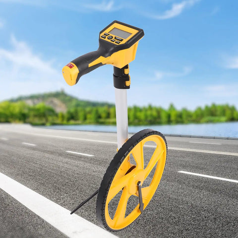 Fauitay Digital measuring wheel with backlit display on a road, showcasing its yellow wheel and digital interface.