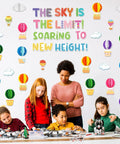 3D Hot Air Balloon Honeycomb Bulletin Board Set For Classroom Decor With Colorful Balloon Cutouts And Cloud Shapes displayed in classroom