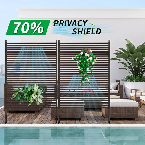 Metal Outdoor Privacy Screen With Stand Freestanding 4 Ft Wide By 6 Ft High Privacy Fence Panel For Patio Garden Backyard Brown PE Coated Steel Slats Panels on patio with plants.