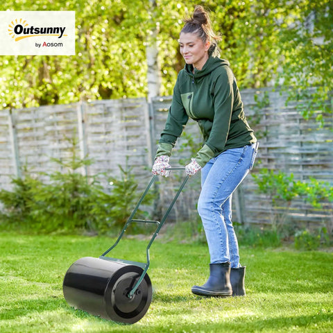 Woman using 20 Inch Push And Tow Behind Lawn Roller With 16 Gallon Water Or Sand Fill Ideal For Flattening Sod And Smoothing Uneven Lawns
