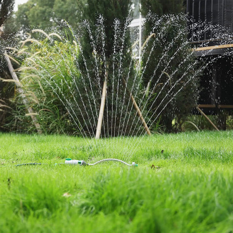 Heavy Duty Oscillating Sprinkler With 18 Brass Nozzles And Stable Metal Base For Big Yards Adjustable Flow Width And Coverage in use