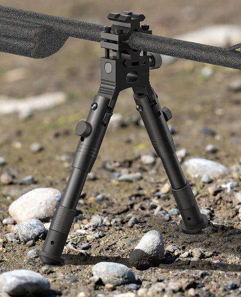 Three In One Rifle Bipod With Picatinny Rail Mount Swivel Stud And Barrel Clamp Adapters in field setting, adjustable legs visible