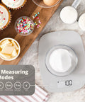 Go-To Slim Digital Kitchen Scale With 1g Precision displaying 100g, ideal for baking and meal prep on kitchen countertop