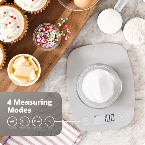 Go-To Slim Digital Kitchen Scale With 1g Precision displaying 100g, ideal for baking and meal prep on kitchen countertop