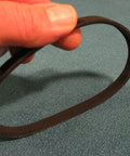 Person holding drive belt for 12 inch wood lathe model 113228360 and 113.228360 replacement belt fits Craftsman lathe