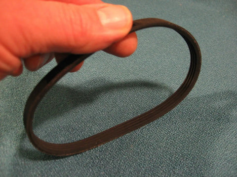Person holding drive belt for 12 inch wood lathe model 113228360 and 113.228360 replacement belt fits Craftsman lathe