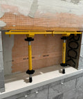 Shower Niche Tiling Tool Kit with aluminum support in use for ceramic tile installation, featuring pro grade niche shelves and spacers.