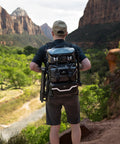 Person wearing Lancer Camera Backpack With 1.5m Extendable Magic Arm For Hands Free POV Vlog And Run And Gun Filming, hiking in nature