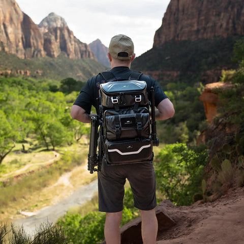Person wearing Lancer Camera Backpack With 1.5m Extendable Magic Arm For Hands Free POV Vlog And Run And Gun Filming, hiking in nature