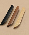 Three oblique angle cabinet door handles in different finishes, featuring oak wood, including the Oak Wood Oblique Angle 4.41 Inch Windbreaker Cabinet Door Handle In Antique Long Walnut Finish, Versatile Pull For Cabinets And Drawers, Suitable For Kitchen, Living Room, Dining Room, And Bedroom Decor, Set Of 2