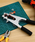 Heavy Duty Welder Ground Clamp With Reinforced Copper Jaw For Superior Grip And RockSolid Electrical Connection During Any Serious Fabrication Or Repair Job on a work surface with tools.