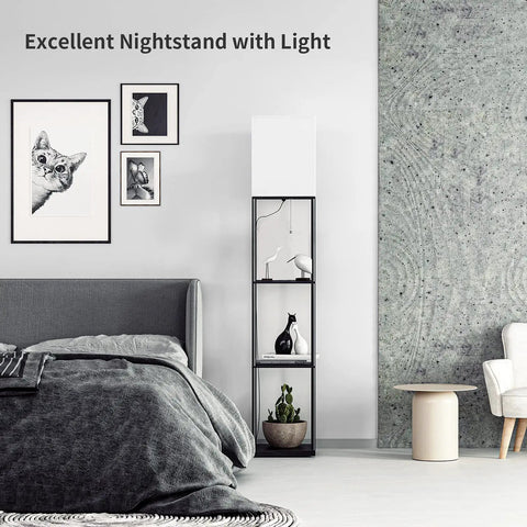 Black space saving floor lamp with shelves next to a bed in a modern room, showcasing stylish decor items.