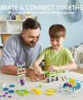 Father and son building with 36-In-1 Motor Robotic Kits For Kids Aged 8-13 Build 14 Motorized Models And More With This Hands-On STEM Toy Set