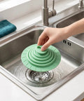 Bekecidi Bathtub Drain Cover, 6-Inch Silicone Tub Stopper, 3 Pack fitted over a sink drain with water flowing.