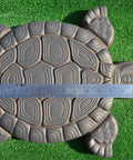 Turtle Shaped Stepping Stone Mold For DIY Concrete Garden Pathway Pavers ABS Plastic Casting Mold Makes Over Fifty Turtles Ideal For Lawn Decor And Patio Paths next to a ruler