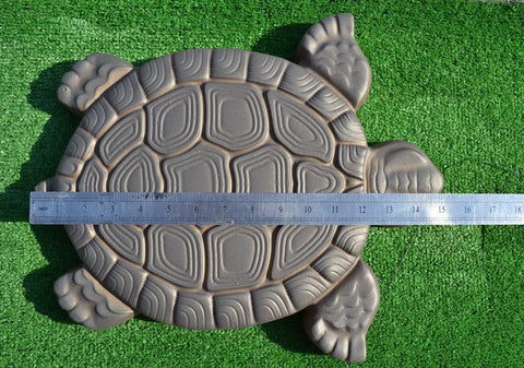 Turtle Shaped Stepping Stone Mold For DIY Concrete Garden Pathway Pavers ABS Plastic Casting Mold Makes Over Fifty Turtles Ideal For Lawn Decor And Patio Paths next to a ruler