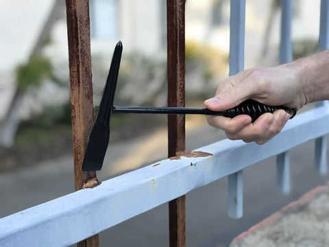 Tough As Nails Welding Chipping Hammer With Comfort Grip Spiral Handle and Anti Rust Tempered Steel Head in action removing rust.
