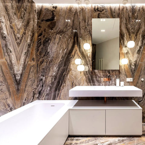 Luxurious bathroom with stone wall, white bathtub, floating sink, reflective mirror, and soft lighting.